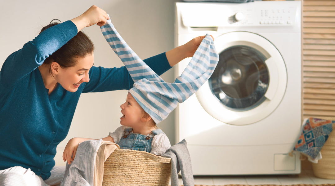 mom and baby doing laundry