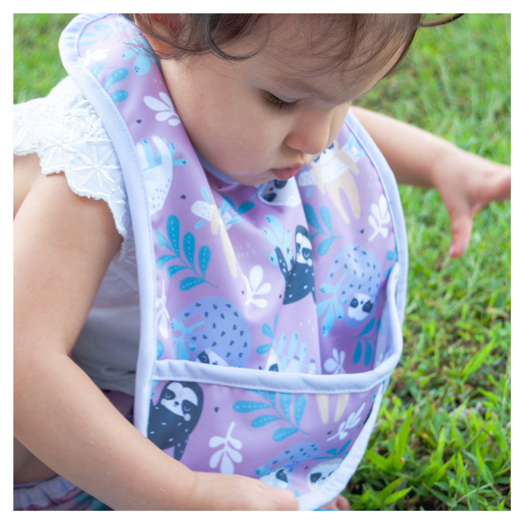 purple waterproof bib on a baby