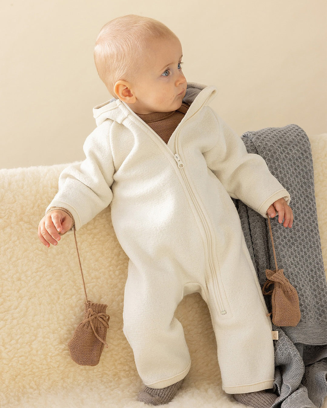 baby in wool snowsuit front