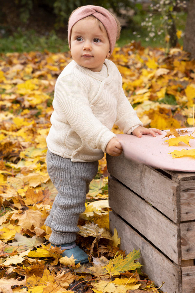 Baby wearing organic wool leggings