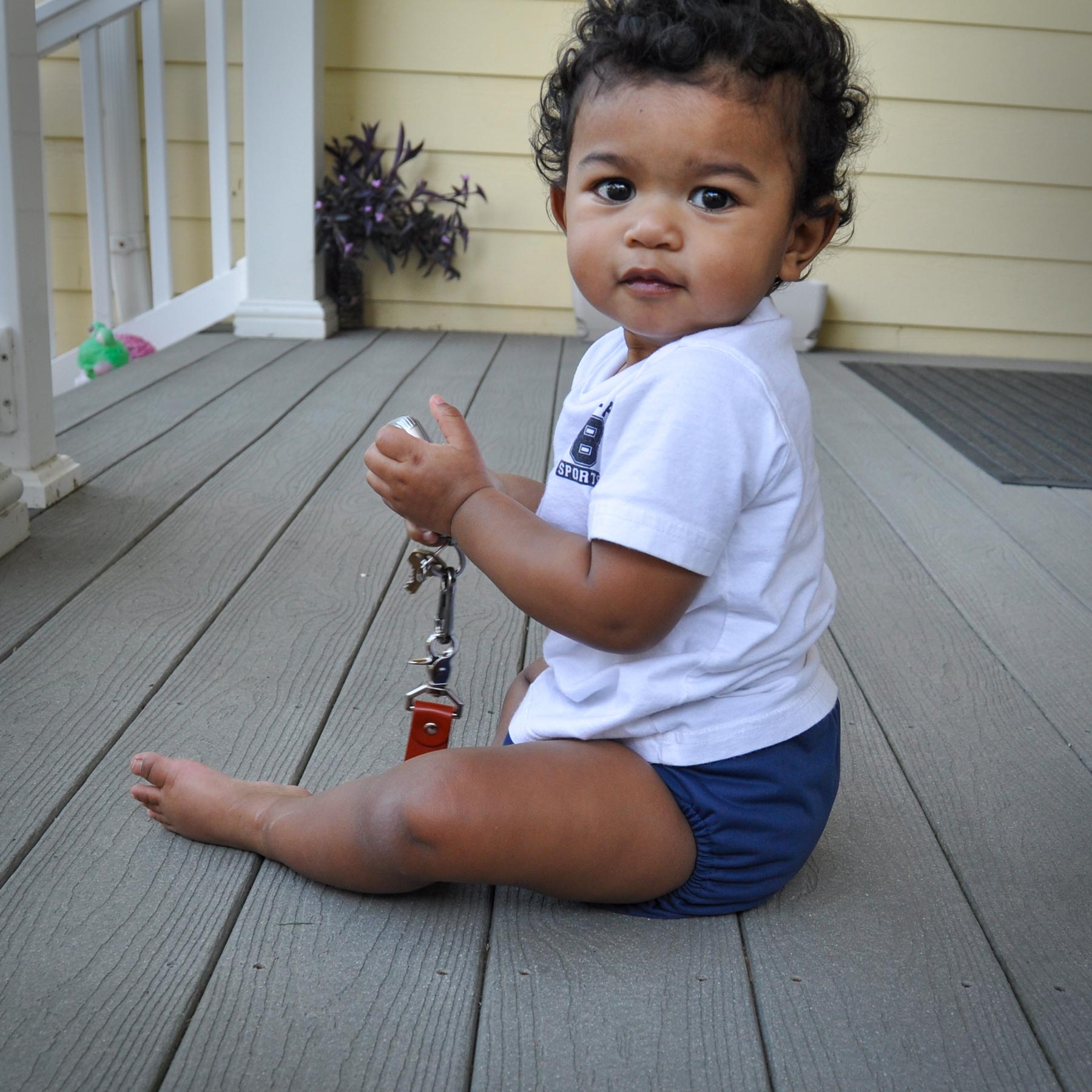 Baby in a navy blue diaper cover