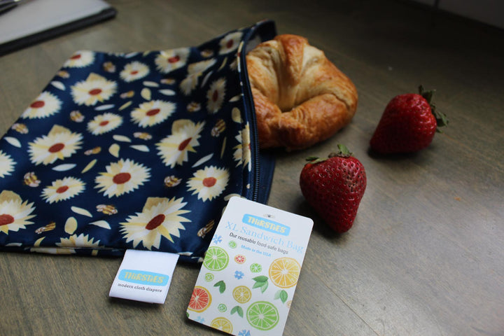 XL sandwich reusable food storage bag with croissant and strawberries