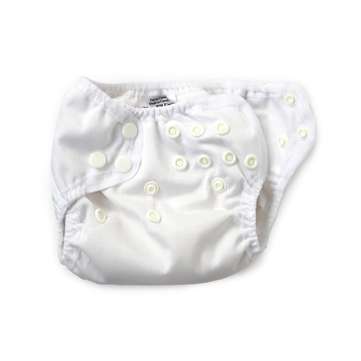 cloth diaper with snaps unsnapped for a newborn baby