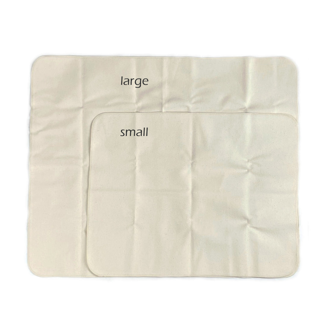 size comparison of Disana cotton waterproof baby pads